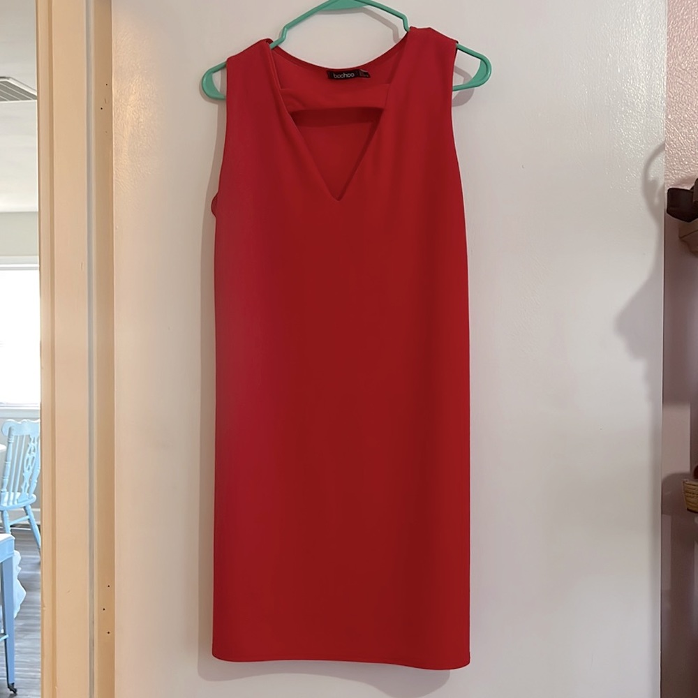 Red shift dress with cut out at neck.